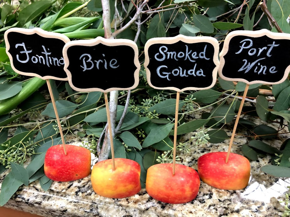 Picture of small chalkboard signs for a cheese display